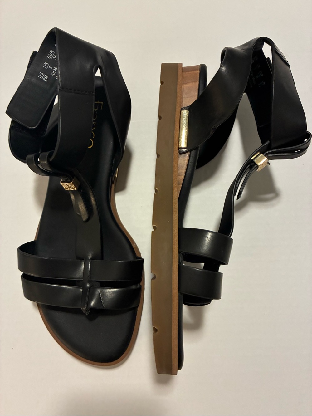 Franco Sarto Black Leather Strappy Ankle-Wrap Flat Sandals with Gold Details